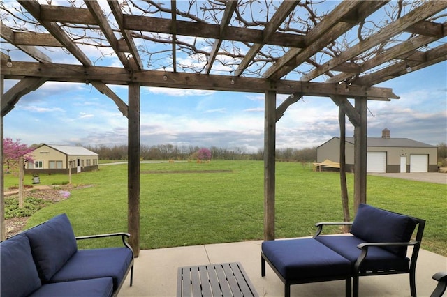 611 NW 1421st Rd, Holden, MO 64040 - view of patio with a pergola, a garage, an outdoor hangout area, and an outbuilding