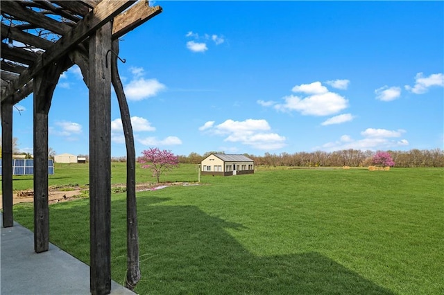 611 NW 1421st Rd, Holden, MO 64040 - view of grassy yard with a pergola and a rural view