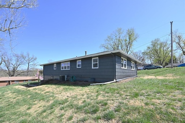 view of home's exterior with a yard