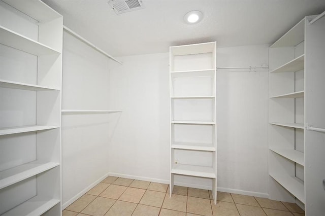 spacious closet with tile patterned flooring and visible vents