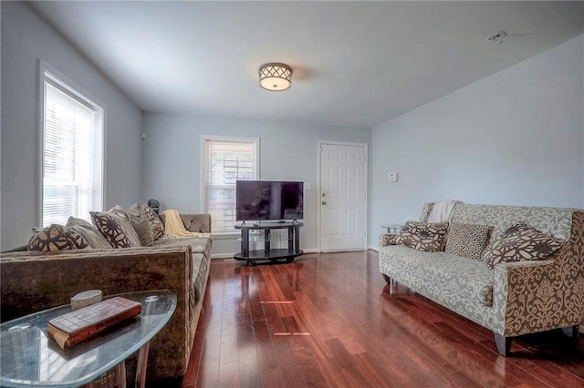 1610 E 37th St, Kansas City, MO 64109 - living area featuring baseboards and wood finished floors