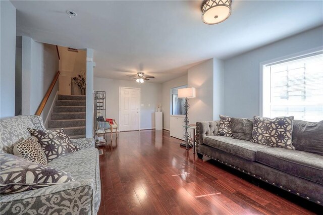1610 E 37th St, Kansas City, MO 64109 - living room with visible vents, baseboards, a ceiling fan, wood finished floors, and stairway
