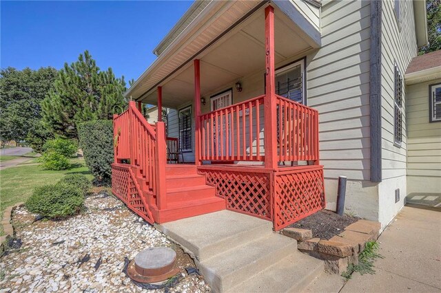 1610 E 37th St, Kansas City, MO 64109 - view of exterior entry with a porch and crawl space