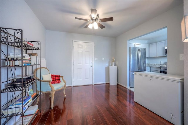 1610 E 37th St, Kansas City, MO 64109 - living area featuring baseboards, dark wood-style floors, and ceiling fan