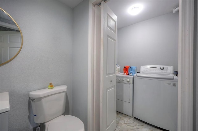 1610 E 37th St, Kansas City, MO 64109 - half bath featuring separate washer and dryer, marble finish floor, and toilet