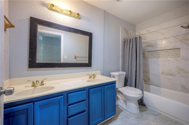 1610 E 37th St, Kansas City, MO 64109 - full bath featuring toilet, shower / bath combo with shower curtain, a sink, and double vanity