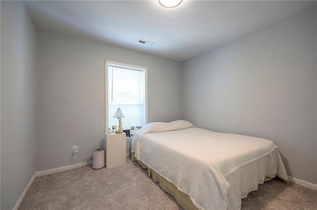 1610 E 37th St, Kansas City, MO 64109 - bedroom featuring baseboards, visible vents, and carpet flooring
