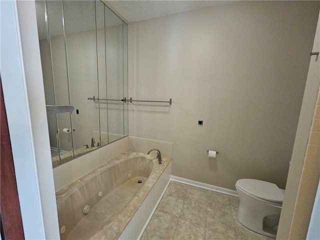 301 E Partridge Ave Unit K, Independence, MO 64055 - full bath with baseboards, a whirlpool tub, toilet, and tile patterned floors