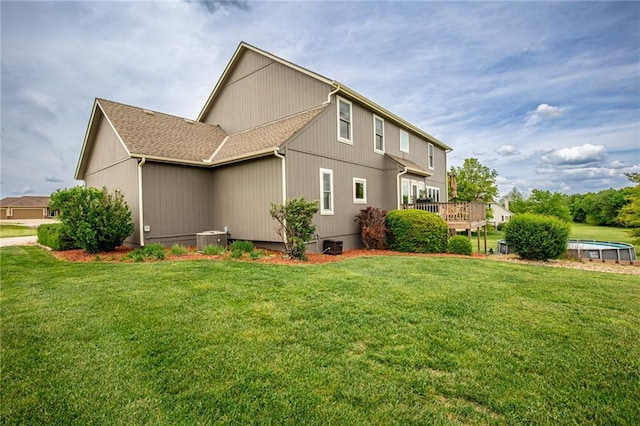25477 Crestview Dr, Paola, KS 66071 - view of property exterior featuring central air condition unit and a yard