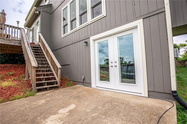 25477 Crestview Dr, Paola, KS 66071 - doorway to property with french doors, a patio, and a wooden deck