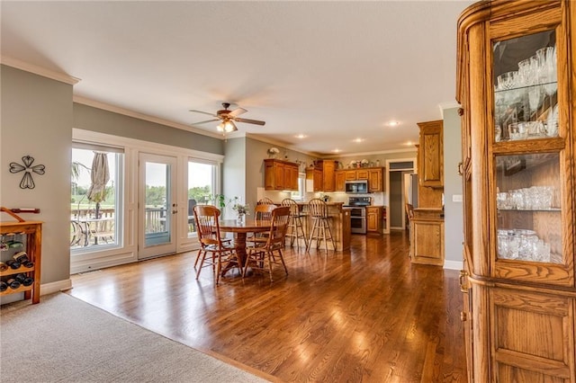 25477 Crestview Dr, Paola, KS 66071 - dining area with ornamental molding, a ceiling fan, dark wood-style flooring, baseboards, and recessed lighting