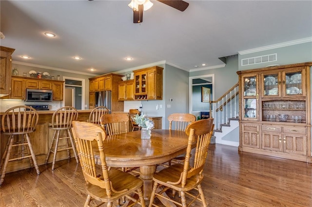 25477 Crestview Dr, Paola, KS 66071 - dining room with crown molding, stairs, a ceiling fan, recessed lighting, and wood finished floors