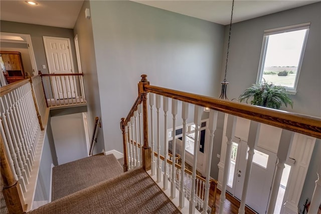 25477 Crestview Dr, Paola, KS 66071 - stairway featuring recessed lighting, baseboards, and wood finished floors