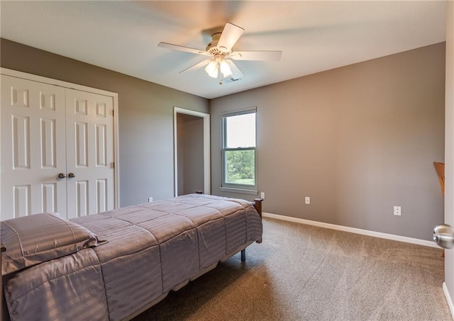 25477 Crestview Dr, Paola, KS 66071 - bedroom featuring baseboards, a closet, carpet floors, and a ceiling fan