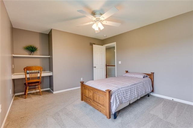25477 Crestview Dr, Paola, KS 66071 - carpeted bedroom featuring baseboards, a ceiling fan, and a desk