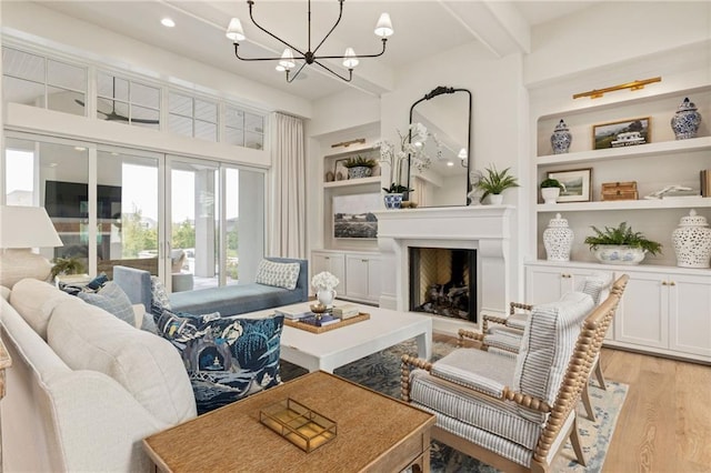 11316 W 170th Ter, Overland Park, KS 66221 - living room with light wood-style floors, a chandelier, built in features, recessed lighting, and a fireplace