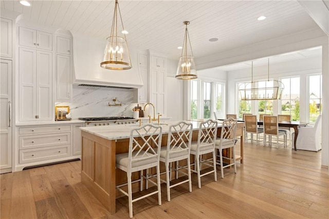 11316 W 170th Ter, Overland Park, KS 66221 - kitchen featuring a chandelier, light wood-style flooring, healthy amount of natural light, recessed lighting, and wood ceiling