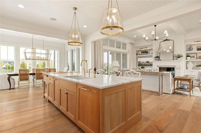 11316 W 170th Ter, Overland Park, KS 66221 - kitchen featuring a chandelier, a sink, light wood-type flooring, open floor plan, and recessed lighting