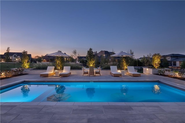 11316 W 170th Ter, Overland Park, KS 66221 - pool at dusk with a patio