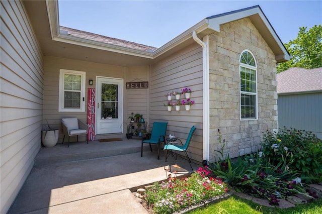 entrance to property with stone siding