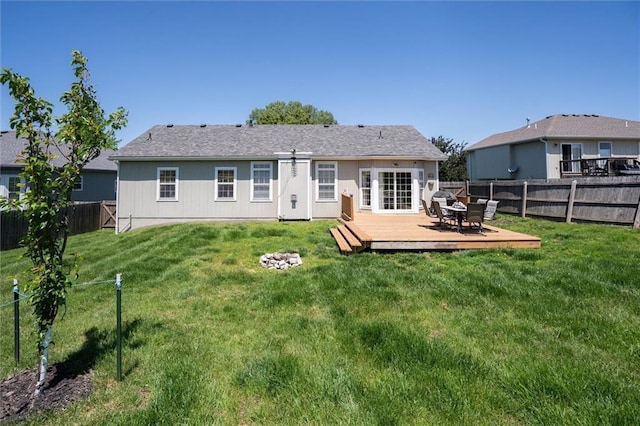 back of property with a deck