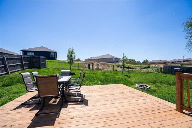 wooden deck featuring outdoor dining area