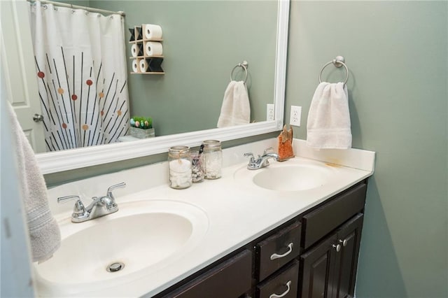 bathroom featuring double vanity and a shower with curtain