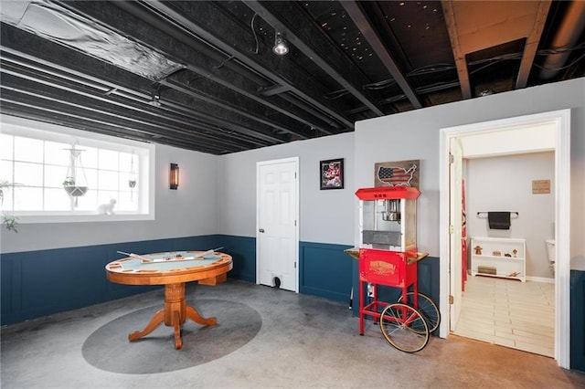 recreation room with concrete floors