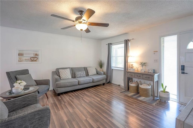 626 N 83rd Ter, Kansas City, KS 66112 - living room with wood finished floors, a textured ceiling, and ceiling fan