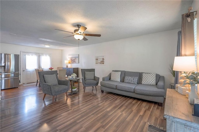 626 N 83rd Ter, Kansas City, KS 66112 - living area with wood finished floors, a textured ceiling, and ceiling fan