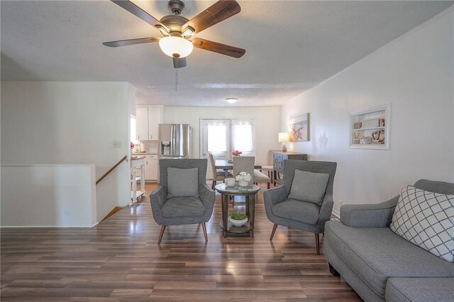 626 N 83rd Ter, Kansas City, KS 66112 - living area with an upstairs landing, ceiling fan, and wood finished floors