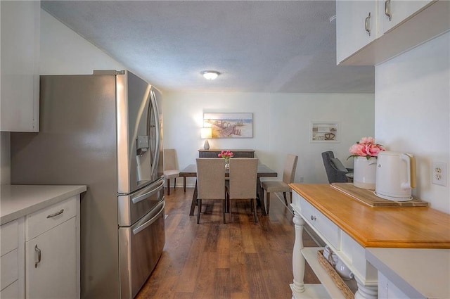 626 N 83rd Ter, Kansas City, KS 66112 - kitchen featuring light countertops, white cabinets, dark wood-style floors, and stainless steel fridge with ice dispenser