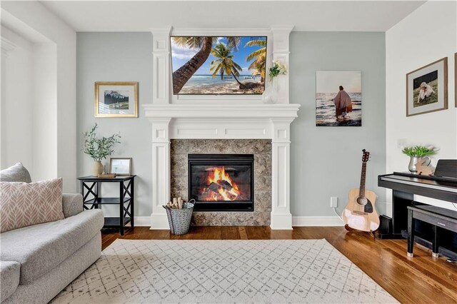 1237 Hillmann Ln, Warrensburg, MO 64093 - living area featuring wood finished floors and a fireplace
