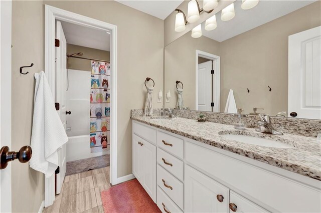 1237 Hillmann Ln, Warrensburg, MO 64093 - full bathroom with double vanity and shower / bath combo