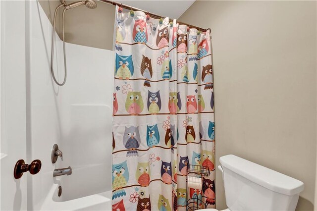 1237 Hillmann Ln, Warrensburg, MO 64093 - bathroom with toilet and shower / bath combination with curtain