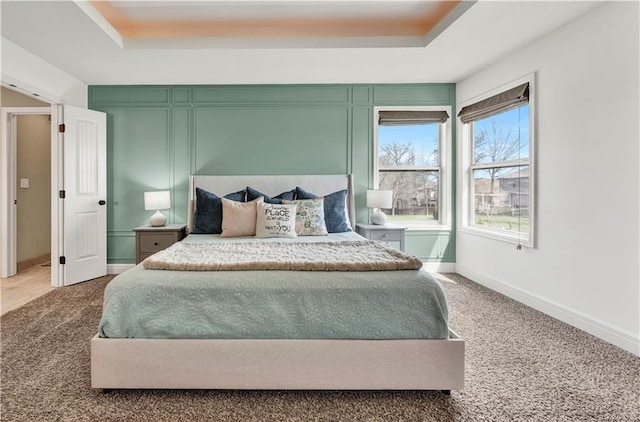 1237 Hillmann Ln, Warrensburg, MO 64093 - bedroom featuring carpet floors and a raised ceiling