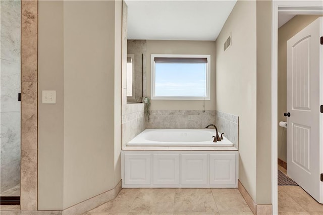 1237 Hillmann Ln, Warrensburg, MO 64093 - bathroom featuring a bath, tile patterned flooring, and a shower