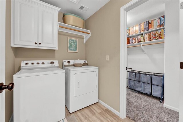 1237 Hillmann Ln, Warrensburg, MO 64093 - laundry area featuring independent washer and dryer and cabinet space