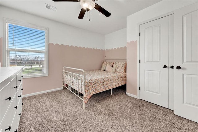 1237 Hillmann Ln, Warrensburg, MO 64093 - bedroom featuring light colored carpet, ceiling fan, and a closet