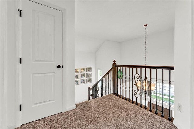 1237 Hillmann Ln, Warrensburg, MO 64093 - stairway with carpet and a chandelier
