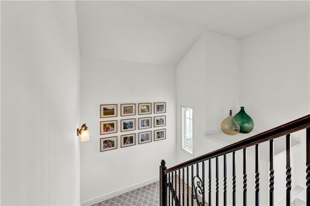 1237 Hillmann Ln, Warrensburg, MO 64093 - staircase featuring baseboards and lofted ceiling