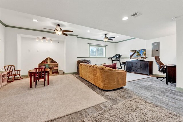 1237 Hillmann Ln, Warrensburg, MO 64093 - living room with a ceiling fan, electric panel, ornamental molding, recessed lighting, and wood finished floors