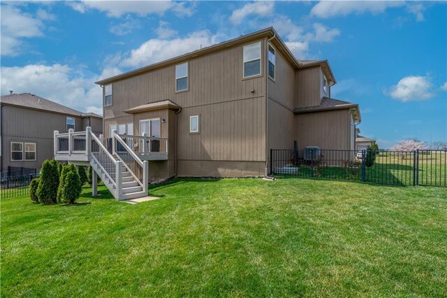1237 Hillmann Ln, Warrensburg, MO 64093 - rear view of property featuring a wooden deck and stairway