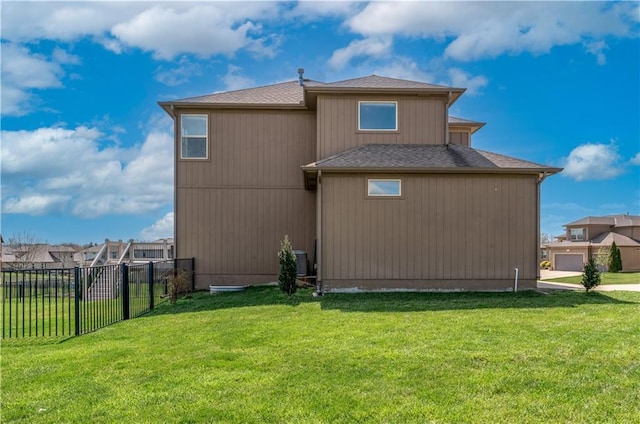 1237 Hillmann Ln, Warrensburg, MO 64093 - view of side of home with roof with shingles and a central AC unit