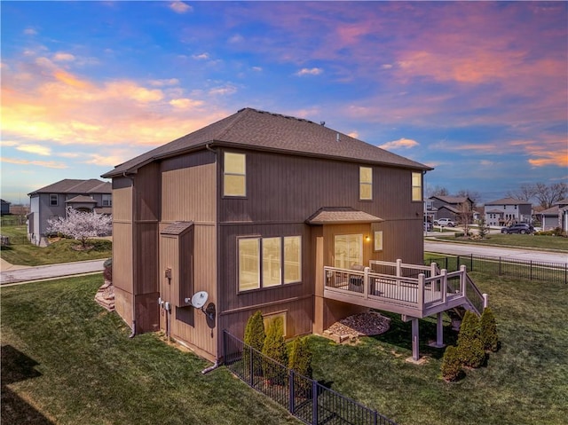 1237 Hillmann Ln, Warrensburg, MO 64093 - back of house featuring a wooden deck and a shingled roof