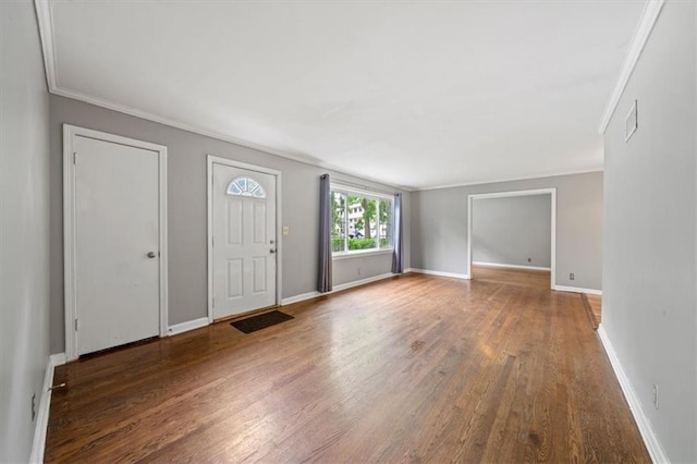 2015 Somerset Dr, Prairie Village, KS 66206 - foyer entrance featuring crown molding, wood finished floors, and baseboards