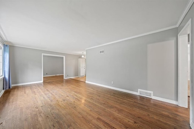 2015 Somerset Dr, Prairie Village, KS 66206 - empty room with crown molding, wood finished floors, and baseboards