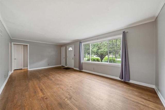 2015 Somerset Dr, Prairie Village, KS 66206 - foyer with crown molding, wood finished floors, and baseboards