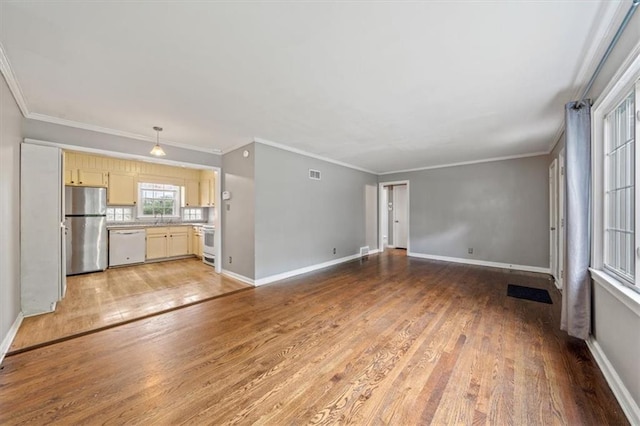 2015 Somerset Dr, Prairie Village, KS 66206 - unfurnished living room featuring light wood finished floors, a sink, baseboards, and ornamental molding
