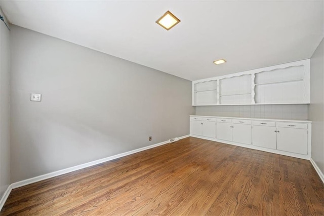 2015 Somerset Dr, Prairie Village, KS 66206 - empty room with wood finished floors and baseboards